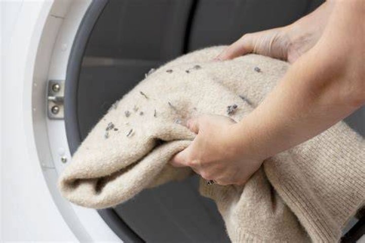 How do you get lint off black clothes after washing?