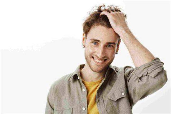 What does it mean when a guy runs fingers through his hair?