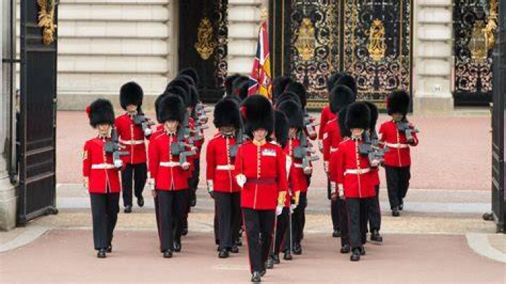 Why do Queens guards have big hats?