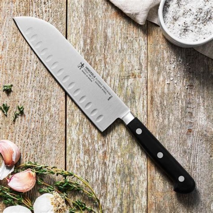 Why do Santoku knives have dimples?